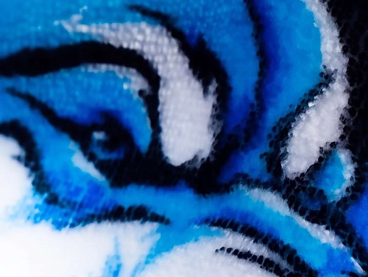 Extreme macro of a sublimated wildcat eye, the color resolving into individual plush fibers